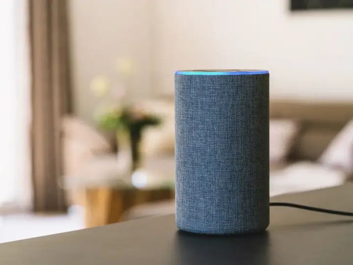 A smart speaker sits on a table